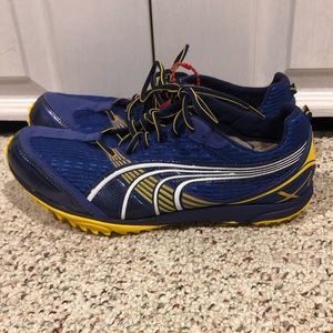 New Puma Haraka XC women’s size 9.5 blue and yellow running shoes.